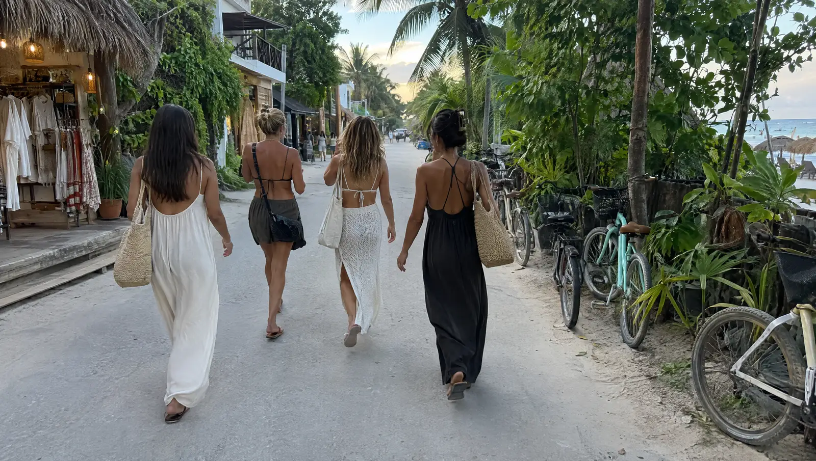 Friends walking along the beach road in Tulum in the afternoon
