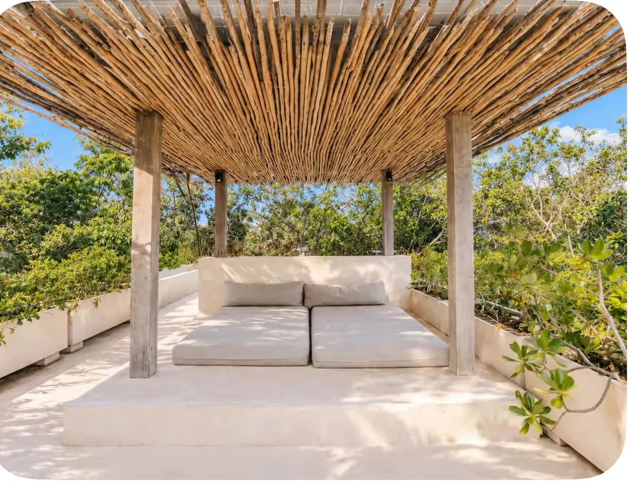 Rooftop daybed under a palapa at Casa Areca